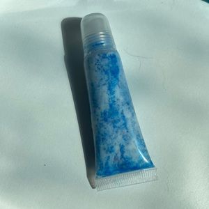 Lip gloss blue and white glittery never used. Handmade never have been used.
